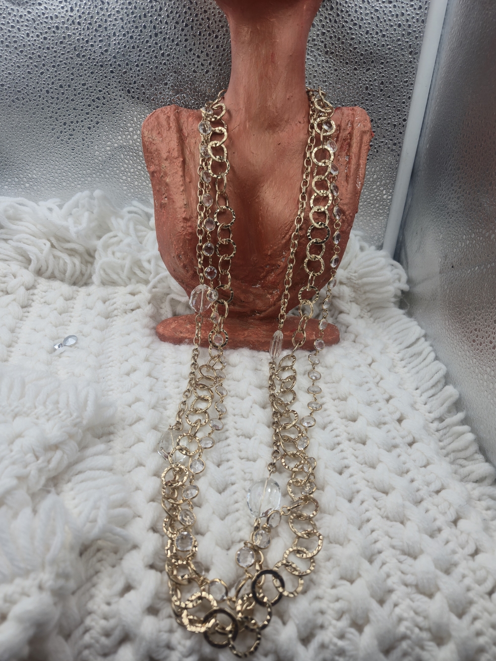 Graziano gold-tone layered design featuring linked hammered circles and interspe